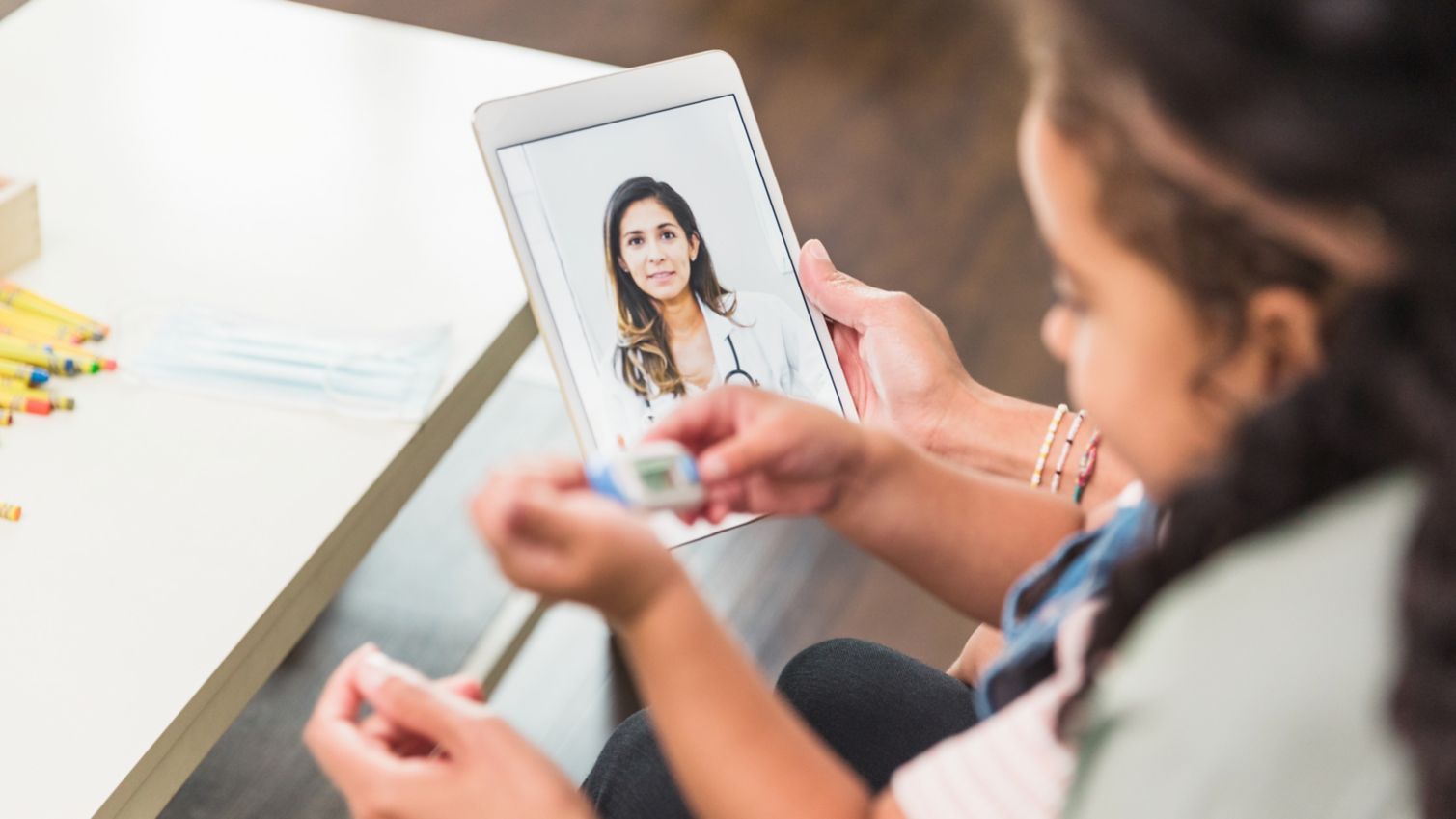 Mother and daughter have a virtual care visit